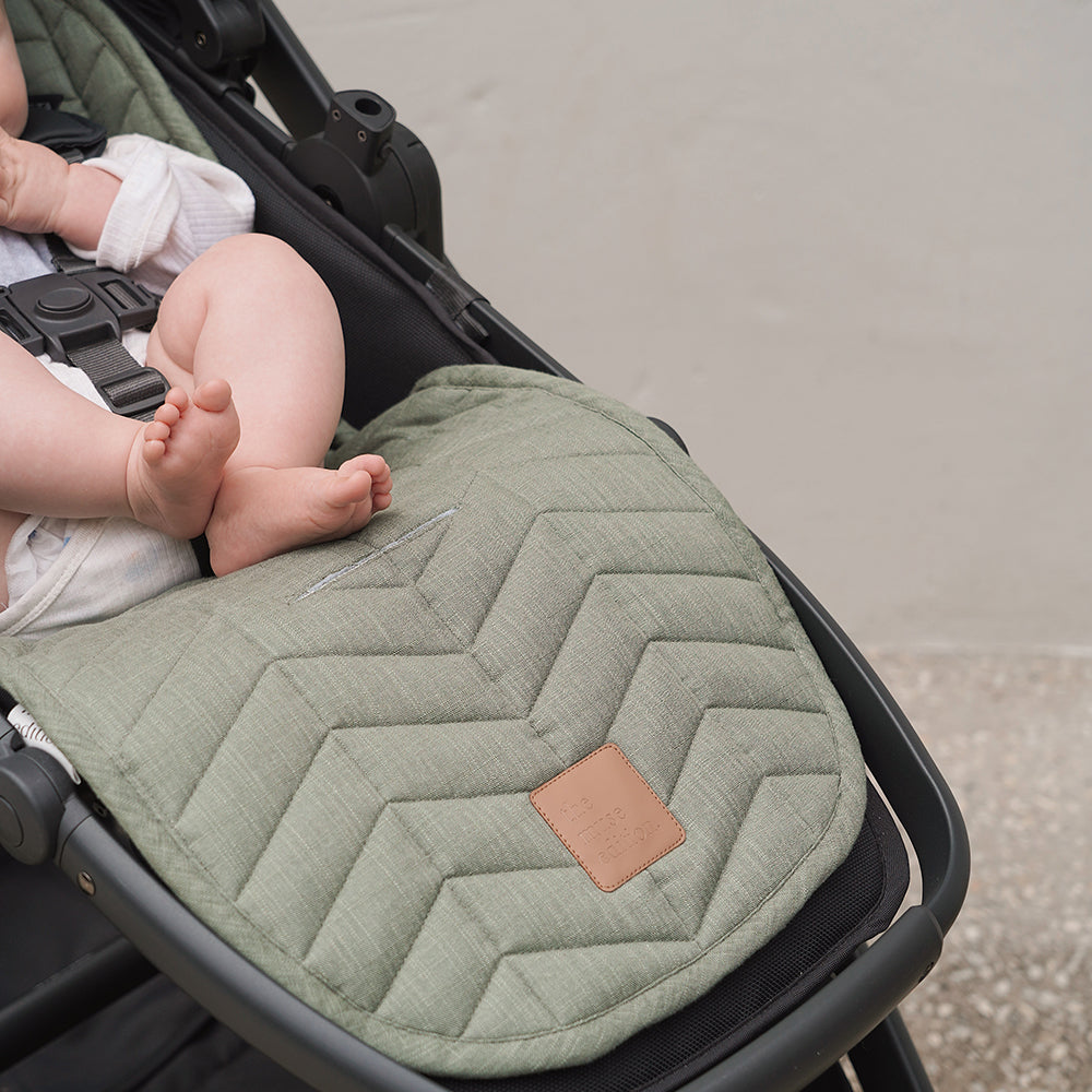 Close up of baby's toes in buggy